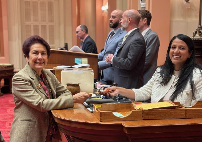 Senator Caballero standing at a podium, presenting the final bill in her 2026 legislative package
